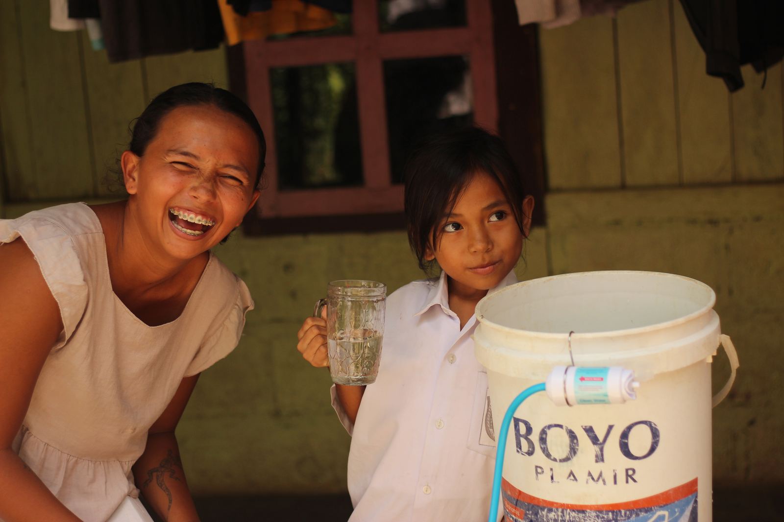 Handing out water filters to local kids